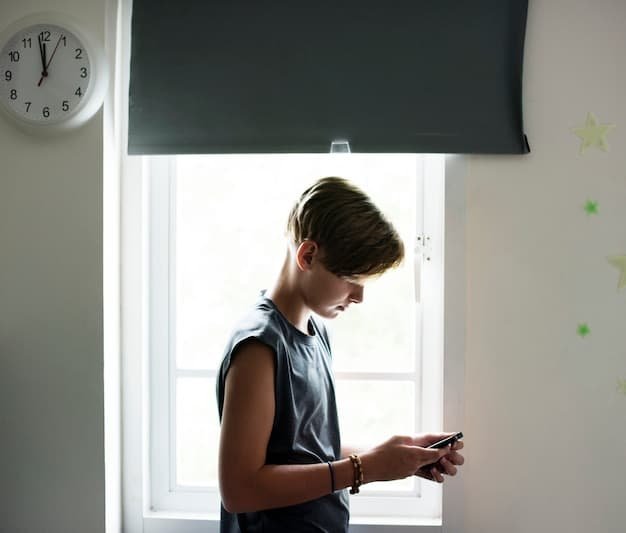 A child turning off their Nintendo Switch as the parental control alarm goes off on a smartphone, demonstrating the alarm feature in action.